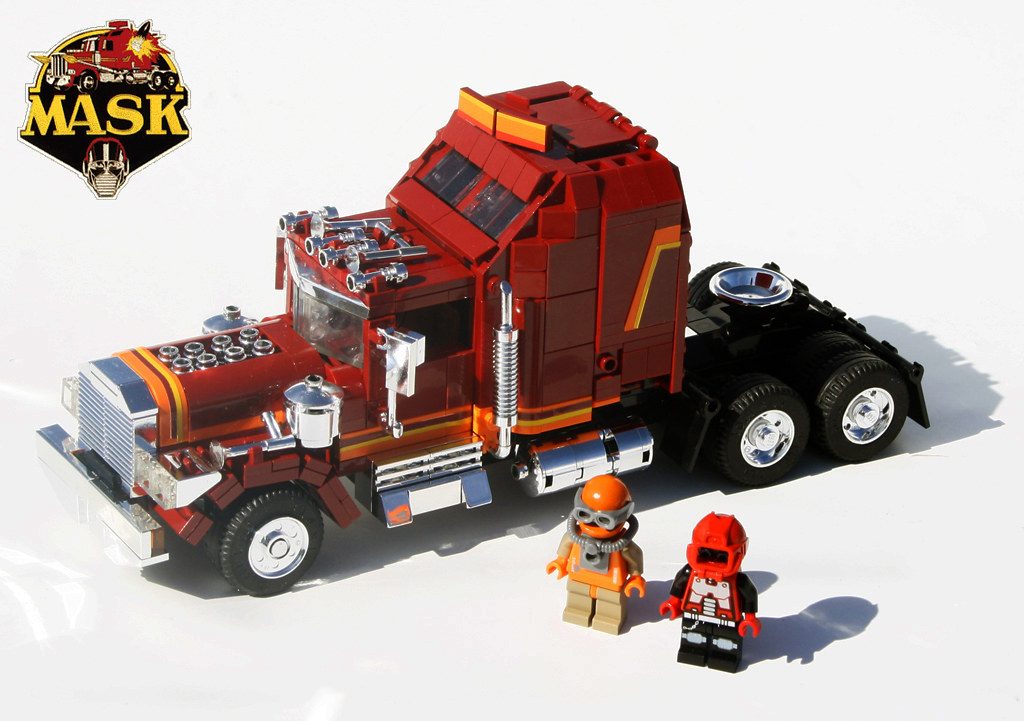 LEGO M.A.S.K. MOC featuring red transforming truck with two minifigures and M.A.S.K. logo.