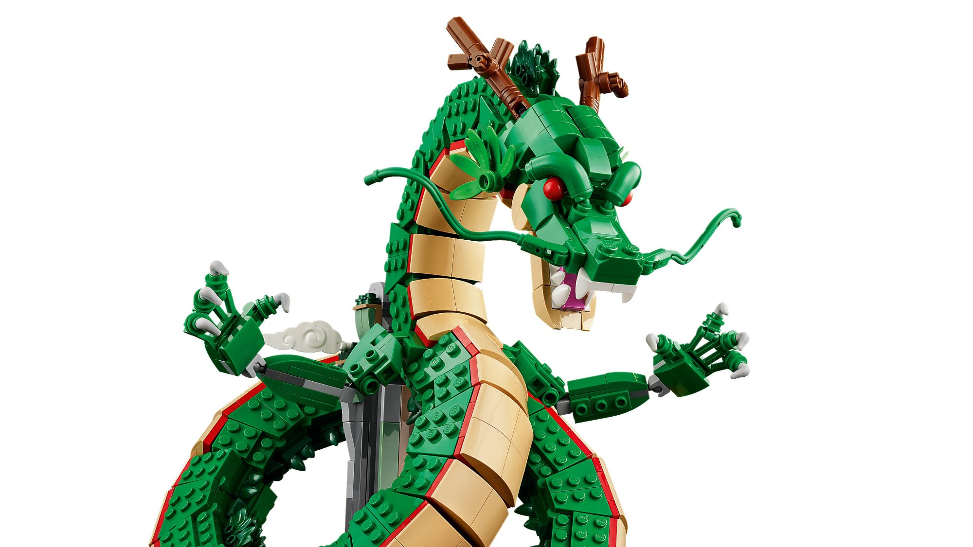 LEGO Shenron dragon set with green scales, tan belly, brown staff, and minifigures positioned on the build.