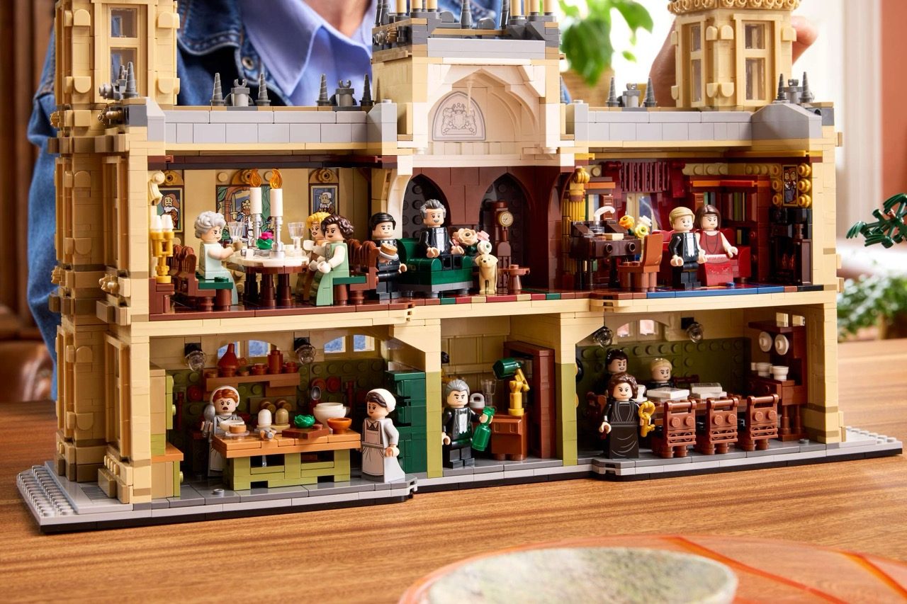 LEGO Downton Abbey set displaying detailed interior rooms with minifigures, architectural features, and period furnishings…