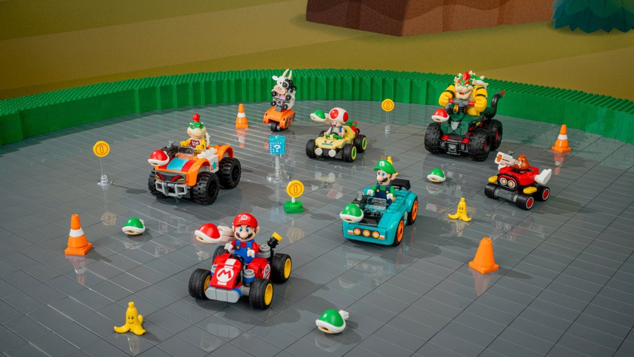 LEGO Super Mario racing set with Mario minifigure in red kart, multiple character vehicles, coins, traffic cones, and powe…