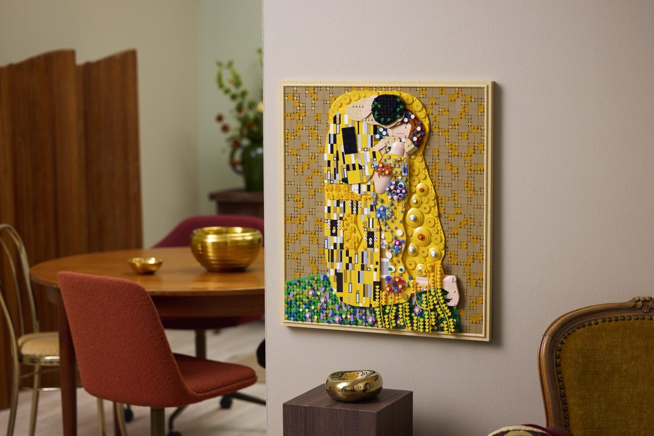 LEGO Art Gustav Klimt "The Kiss" set displayed on a wall in an elegant dining room setting.