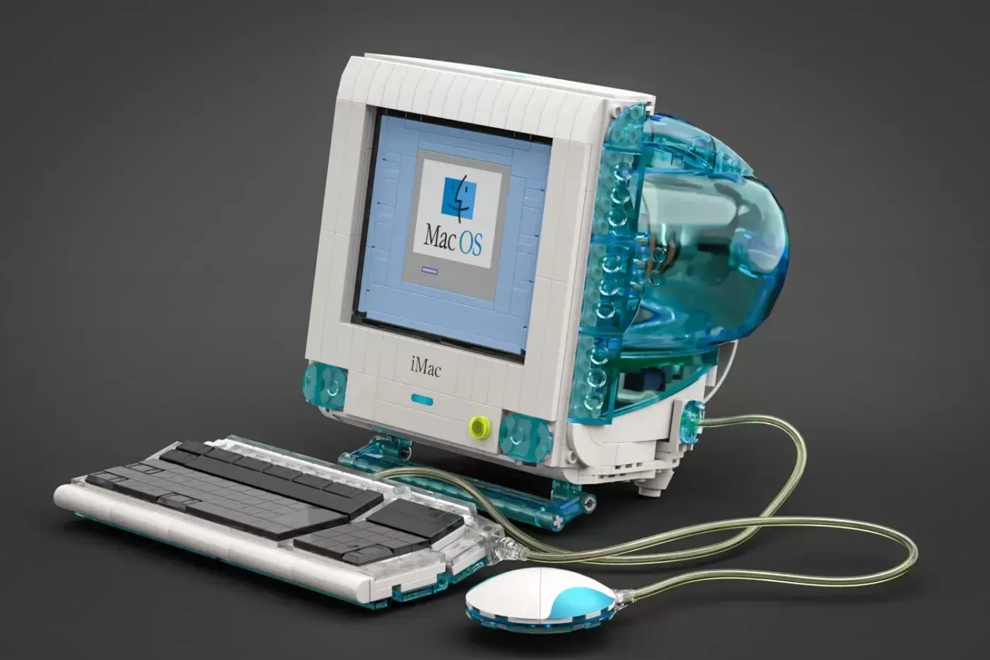 LEGO iMac computer with translucent turquoise case, keyboard, and mouse displaying Mac OS startup screen.