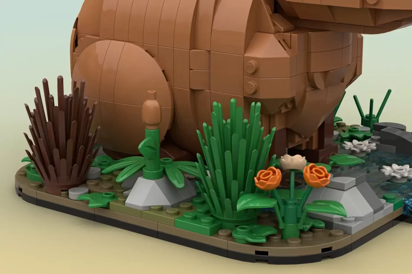 LEGO capybara relaxing in desert landscape with cacti, flowers, and wooden structure on tan base.