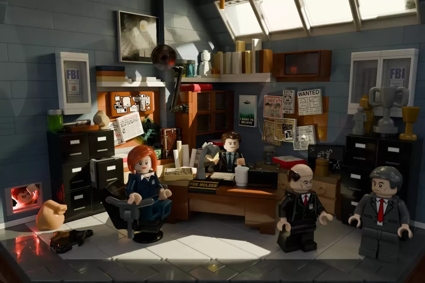 LEGO X-Files FBI office set with Mulder and Scully minifigures, desk, filing cabinets, and UFO display.