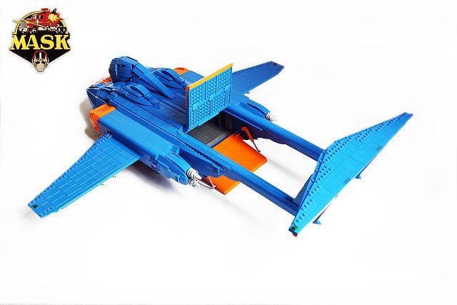 LEGO M.A.S.K. blue and orange jet aircraft MOC with transforming vehicle design and pilot minifigure.