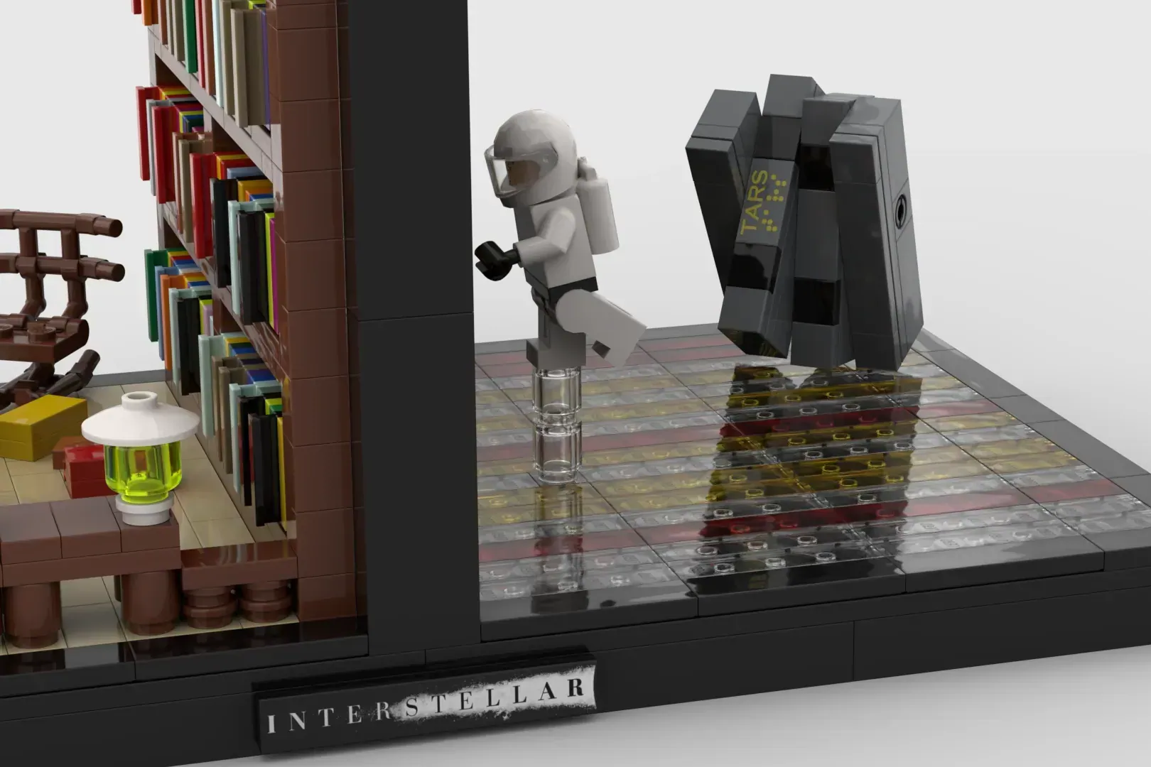 LEGO Interstellar bookend featuring astronaut minifigure, TARS robot, library shelves, and stacked books on black base.