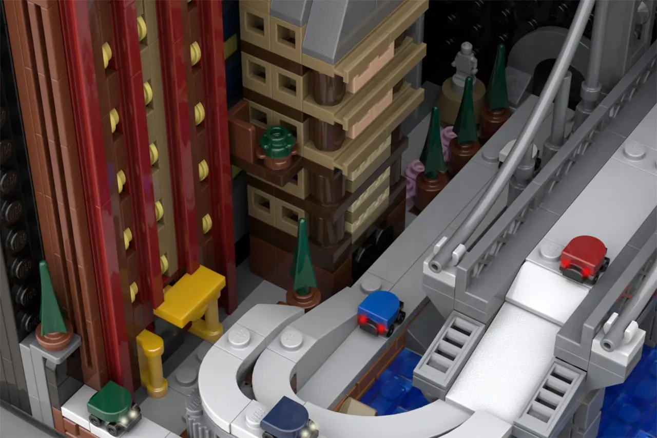 LEGO city street scene with red curtained building, vehicles, trees, and detailed urban architecture elements.