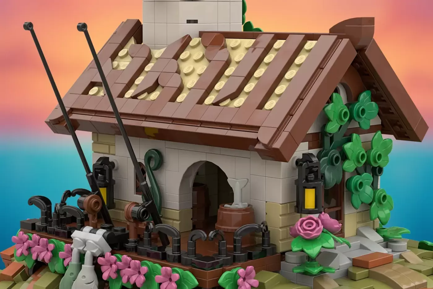 LEGO fisherman's cottage with brown roof, white walls, pink flowers, green ivy, fishing nets, and nautical details.