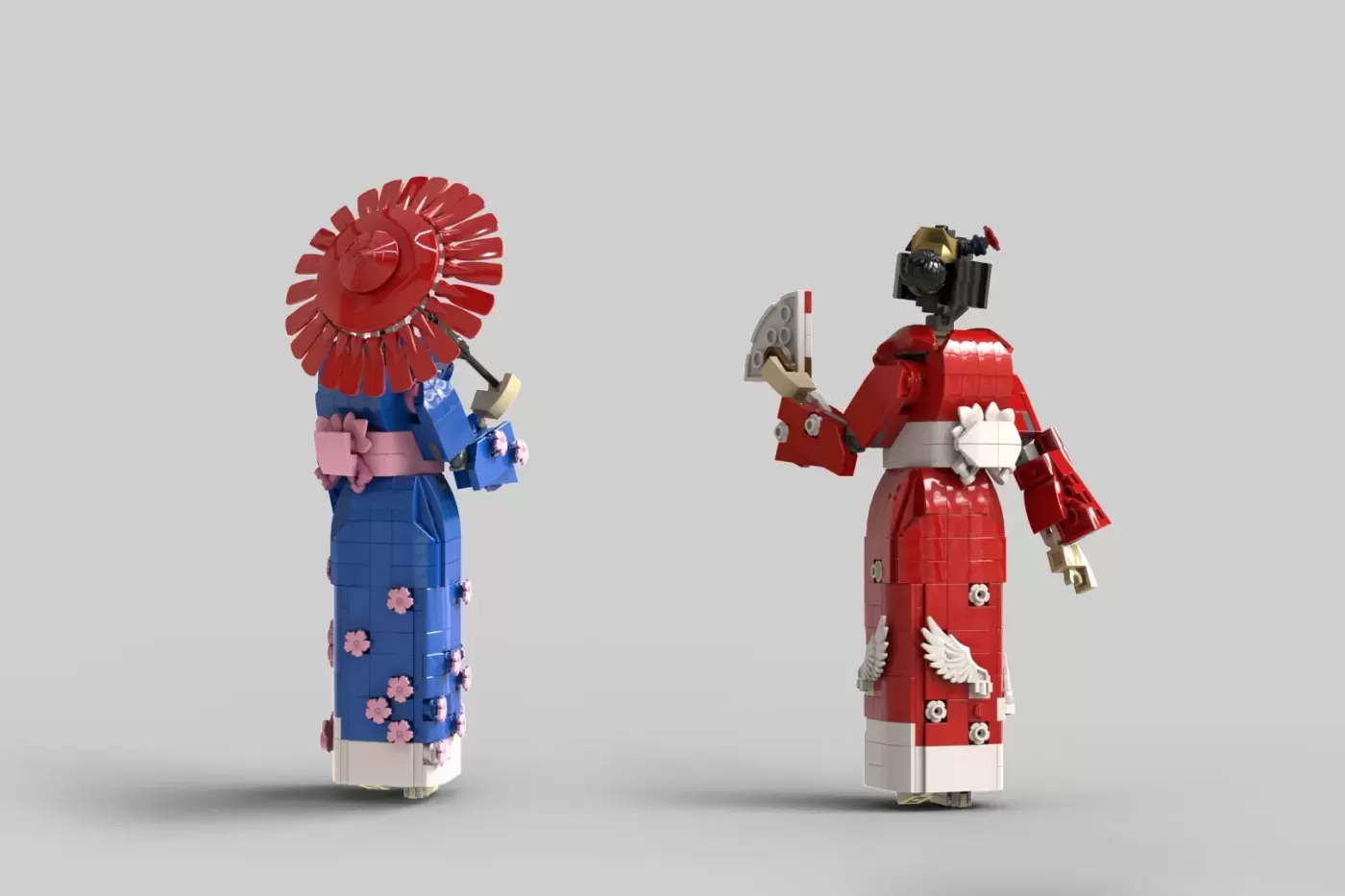 Two LEGO minifigures in traditional kimono outfits with poseable joints, featuring red and blue designs with floral patterns.