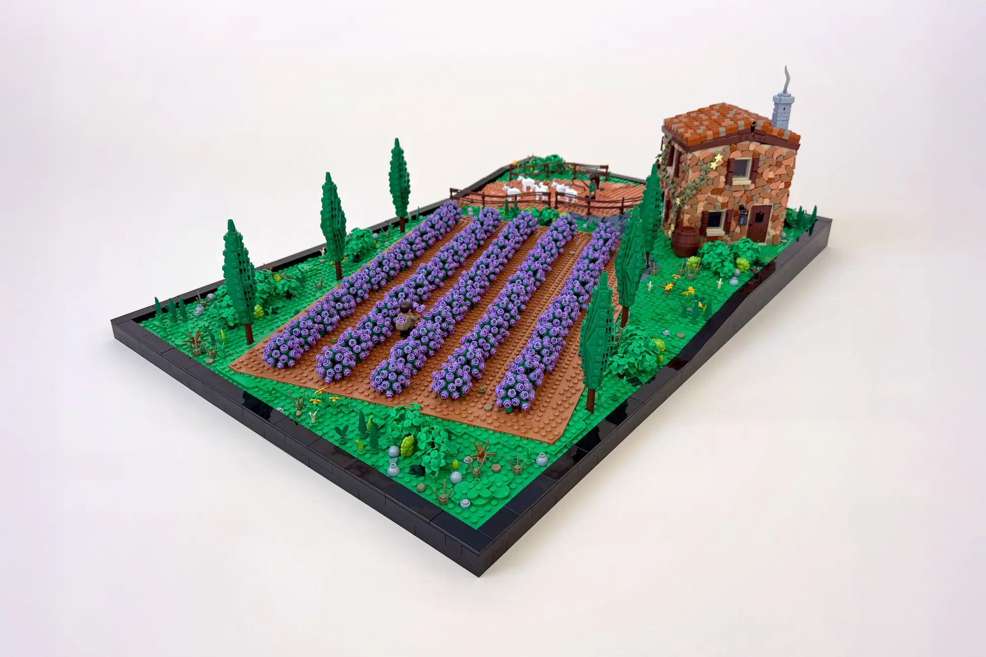 LEGO lavender field with tuscan villa, cypress trees, and unique wall building technique on display base.