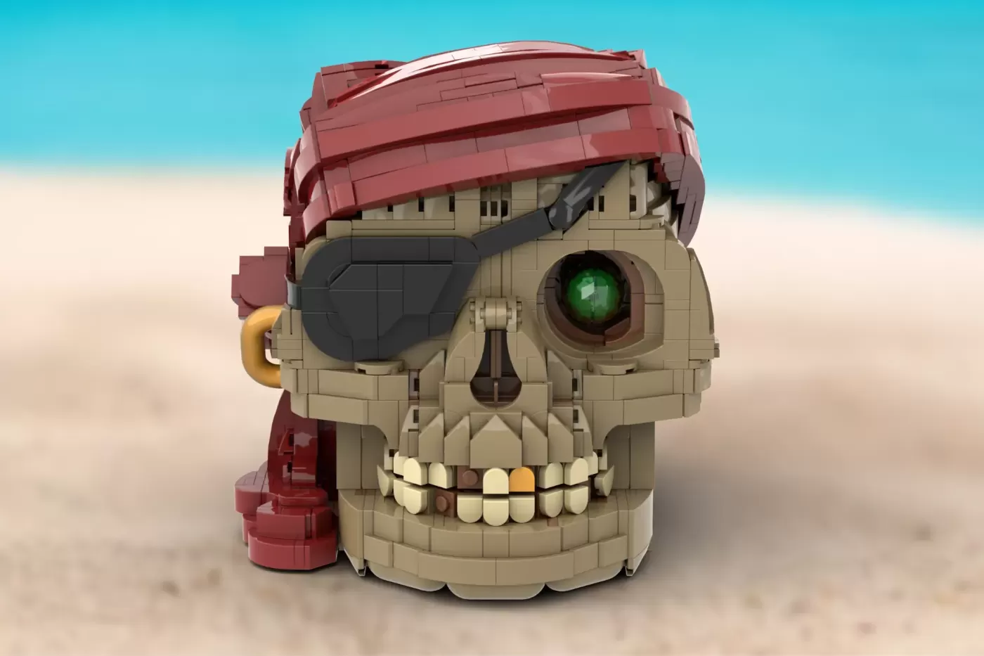 LEGO pirate skull with red hat, eye patch, green glowing eye, and gold ear detail on sandy beach background.