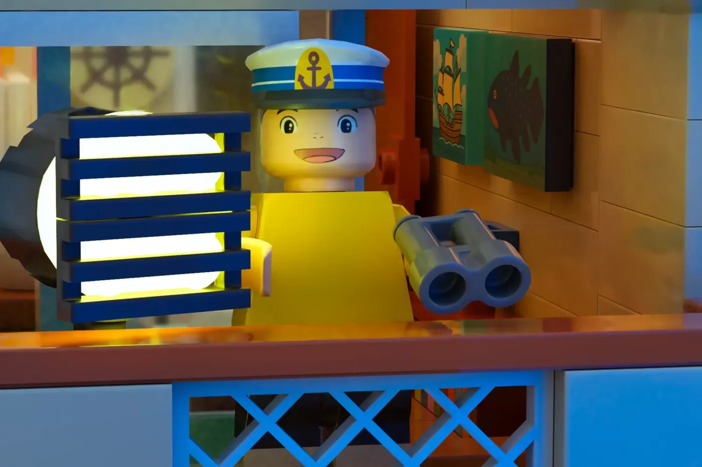 LEGO sailor character with yellow body and captain's hat beside binoculars and striped lighthouse on wooden shelf.