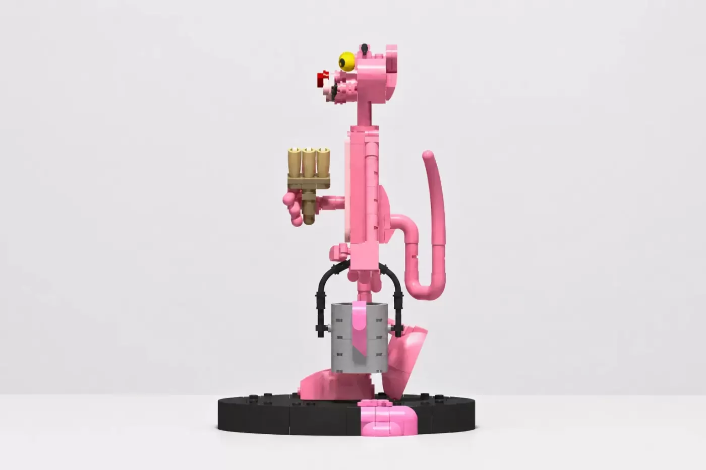 Pink Panther LEGO MOC with paintbrush, holding paint palette, on black base with pink and gray brick details.