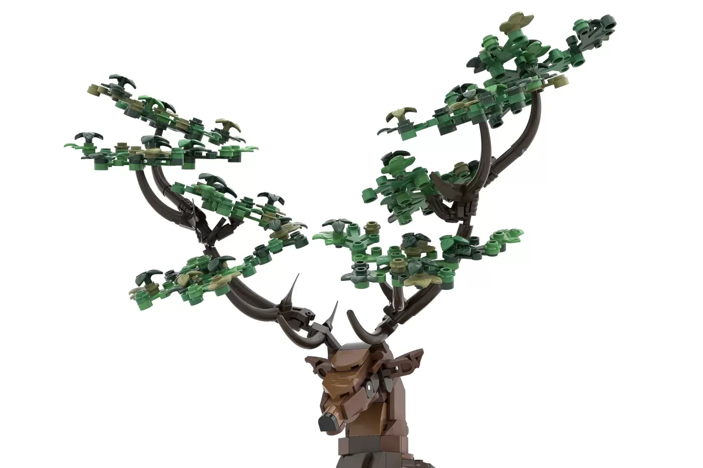 LEGO stag sculpture with brown body and antlers featuring seasonal green foliage branches.