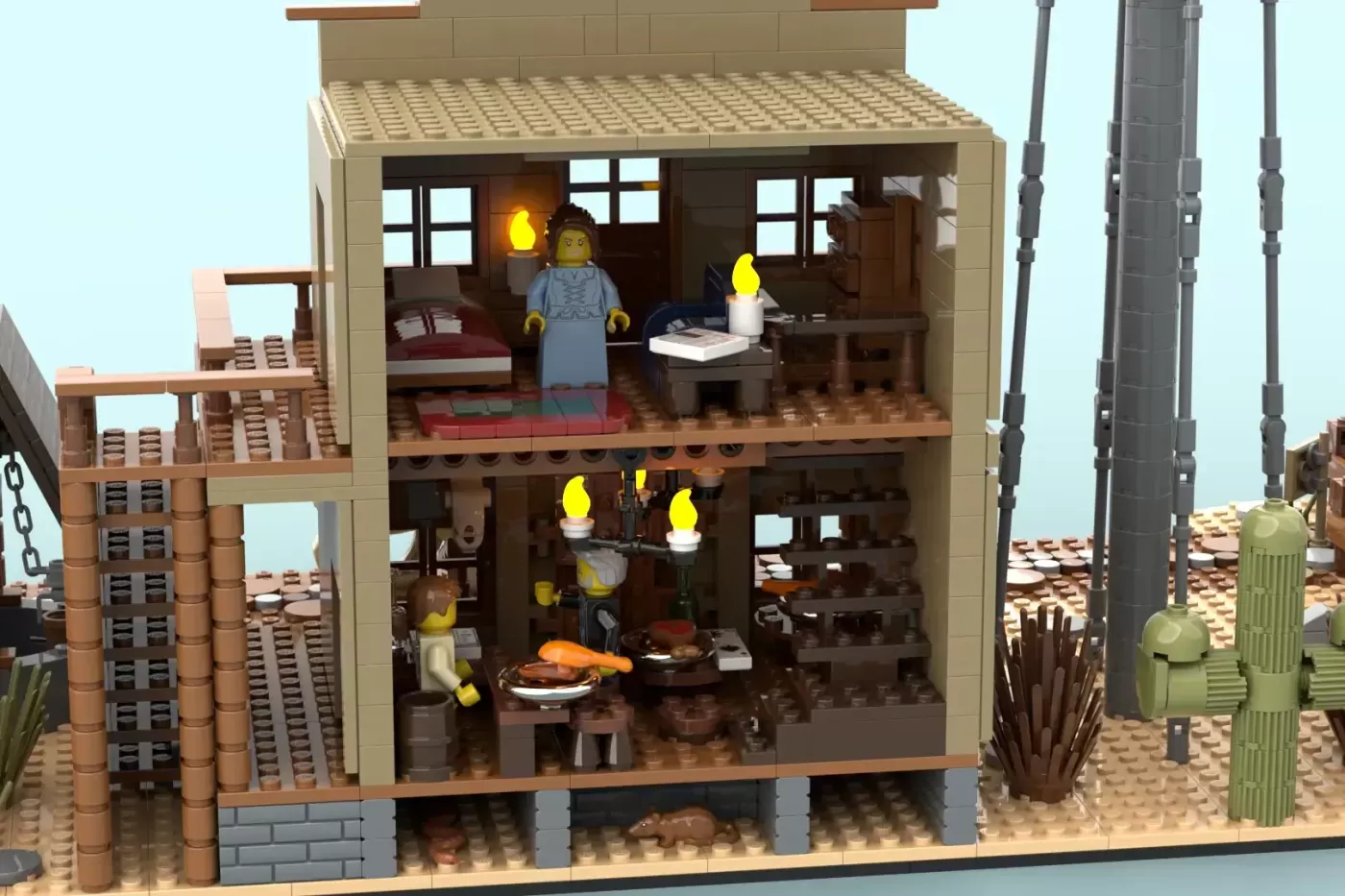 LEGO Western saloon building with two floors, minifigures, yellow flame lamps, and desert landscape details.