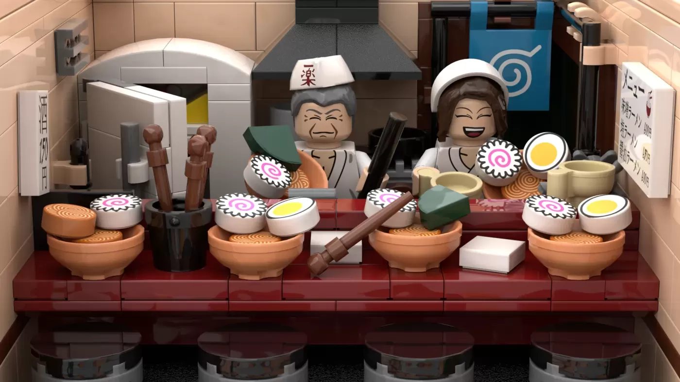 LEGO Ichiraku Ramen Shop set with two minifigures behind counter, detailed kitchen equipment, and decorative food pieces.