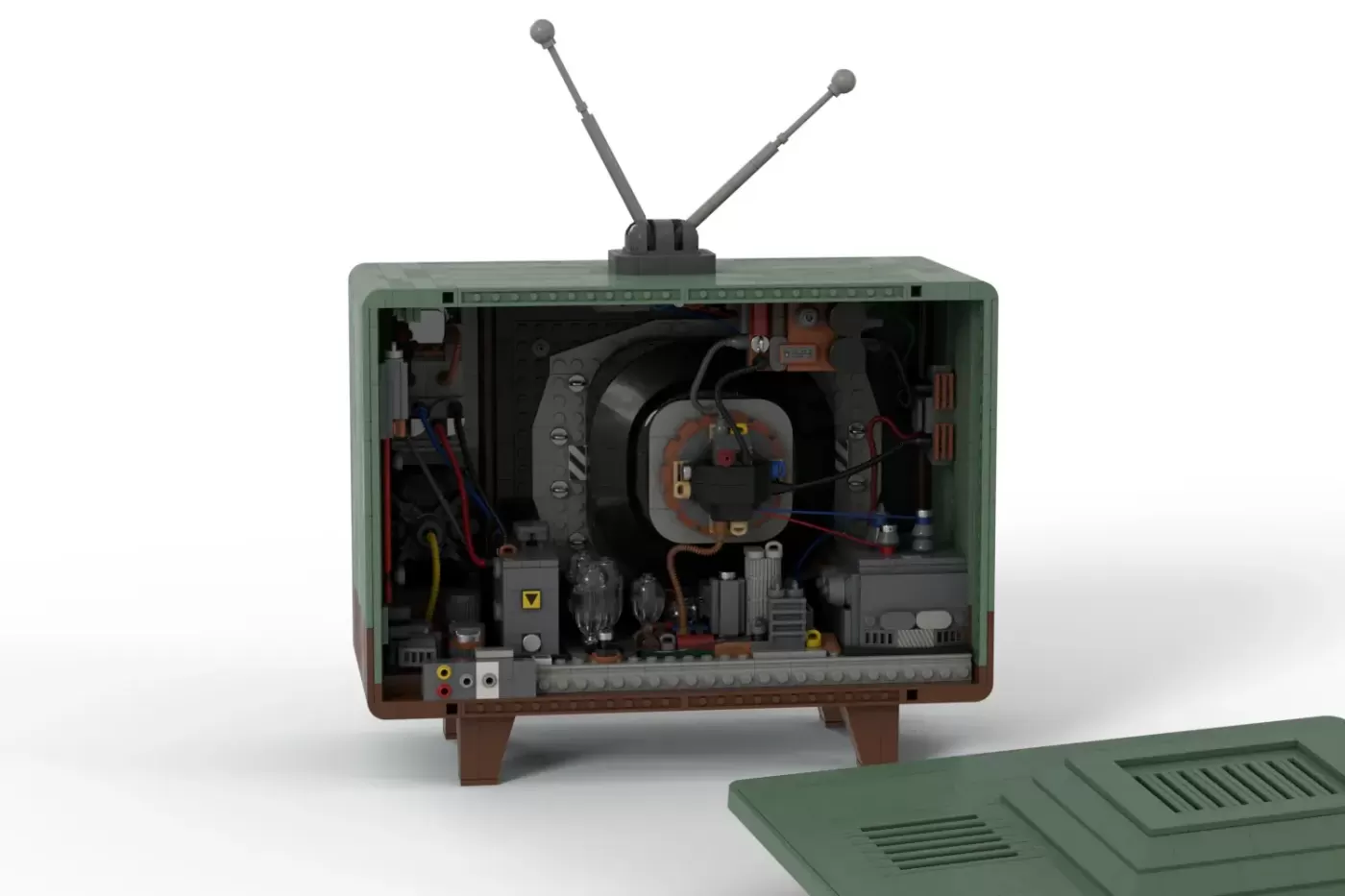 LEGO classic TV set with exposed interior showing tubes, circuits, and rabbit ear antennas on top.