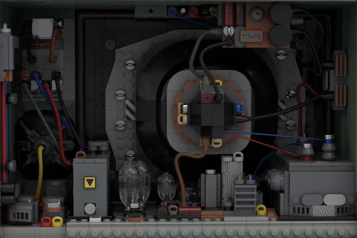 Detailed LEGO diorama of vintage TV's interior showing exposed vacuum tubes, circuits, wiring, and mechanical components.