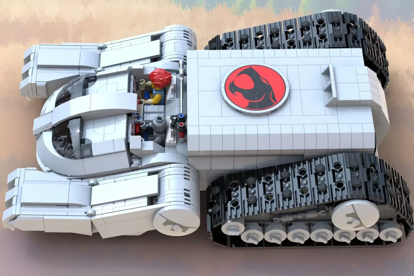 LEGO ThunderCats Thundertank with red minifigure, tracked treads, and iconic red logo on white hull.
