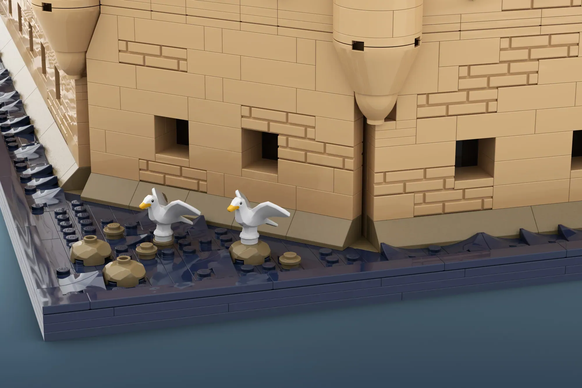 LEGO Belém Tower model showing detailed brick architecture with seagull figures and ornamental deck elements.