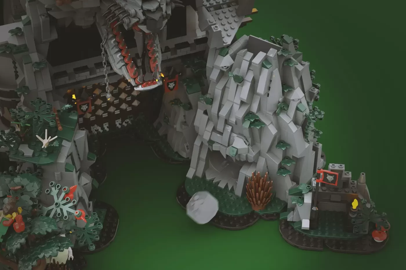Overhead view of LEGO Wolfpack Fanghold castle set featuring stone wolf sculpture, detailed fortifications, and minifigure…