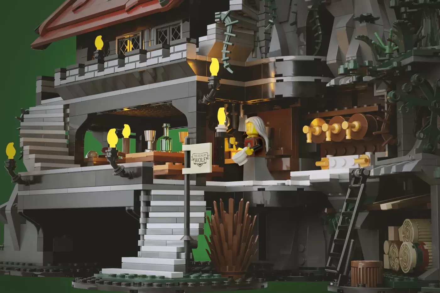 LEGO Wolfpack Fanghold castle set featuring a multi-level stone structure with yellow lanterns, minifigures, and detailed …